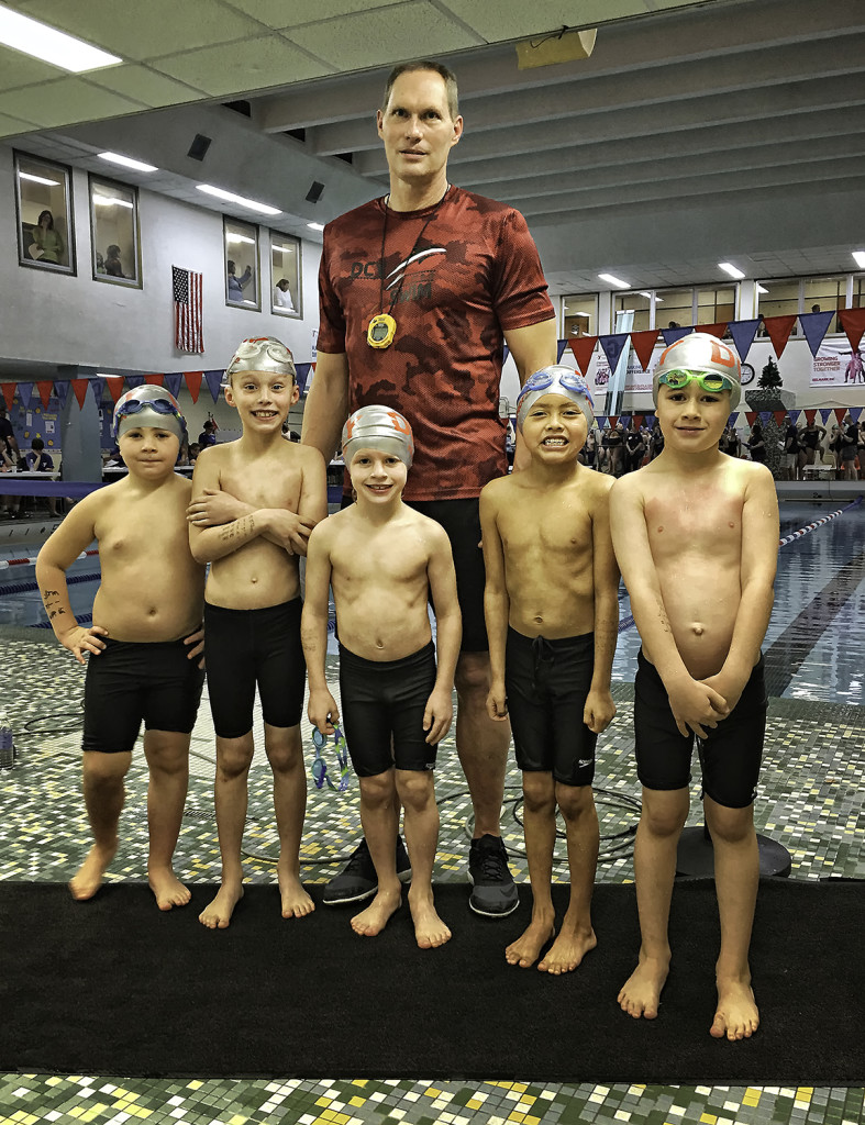 The 8 & under swimmers on DCY SWIM are among the best in the state. Pictured are Jaxon Rankin, Jack Monfils, Coach Mike McHugh, Luke Filar, Ryan Felhofer and Colton Blackley. Photo by Suzanne Rose.