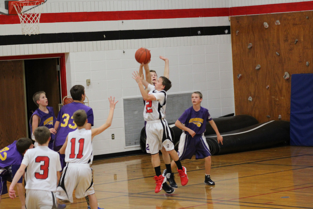 The Sevastopol Pioneers attempt to score against Kewaunee in a home game this season. The Pioneers 8th grade boys basketball team finished the season with a 6-4 record. Submitted.