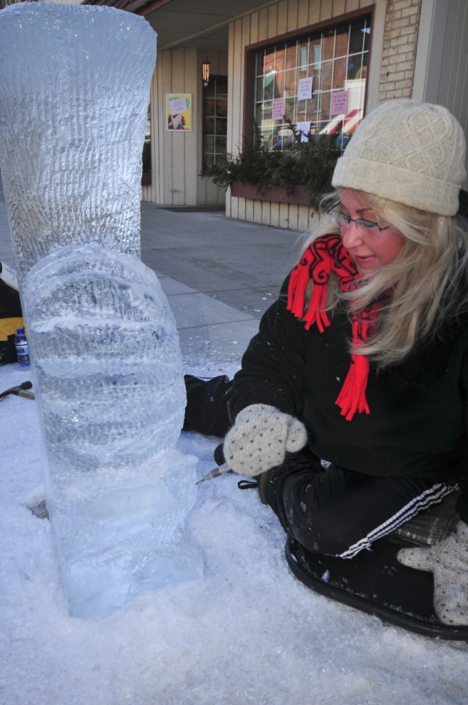 Sculptor carving a block of ice during Sturgeon Bay's Fire and Ice Festival. Submitted. 