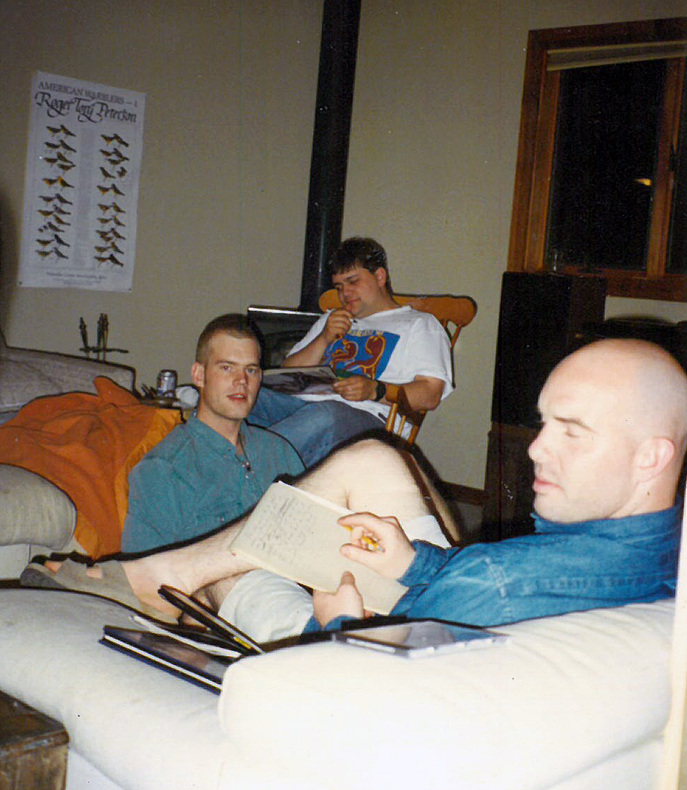 Publisher David Eliot (center) holds an editorial meeting with Neal Gallagher and Chris “Fuzzy” Hanaway.
