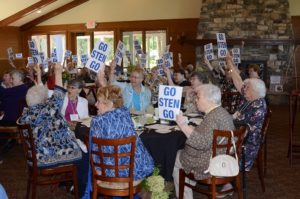 All of the 144 attendees held up GO STEN GO signs and cheered after hearing about the amazing progress Gibraltar High School student Sten Kordon has made since his Aug. 28 boating accident in Fish Creek.