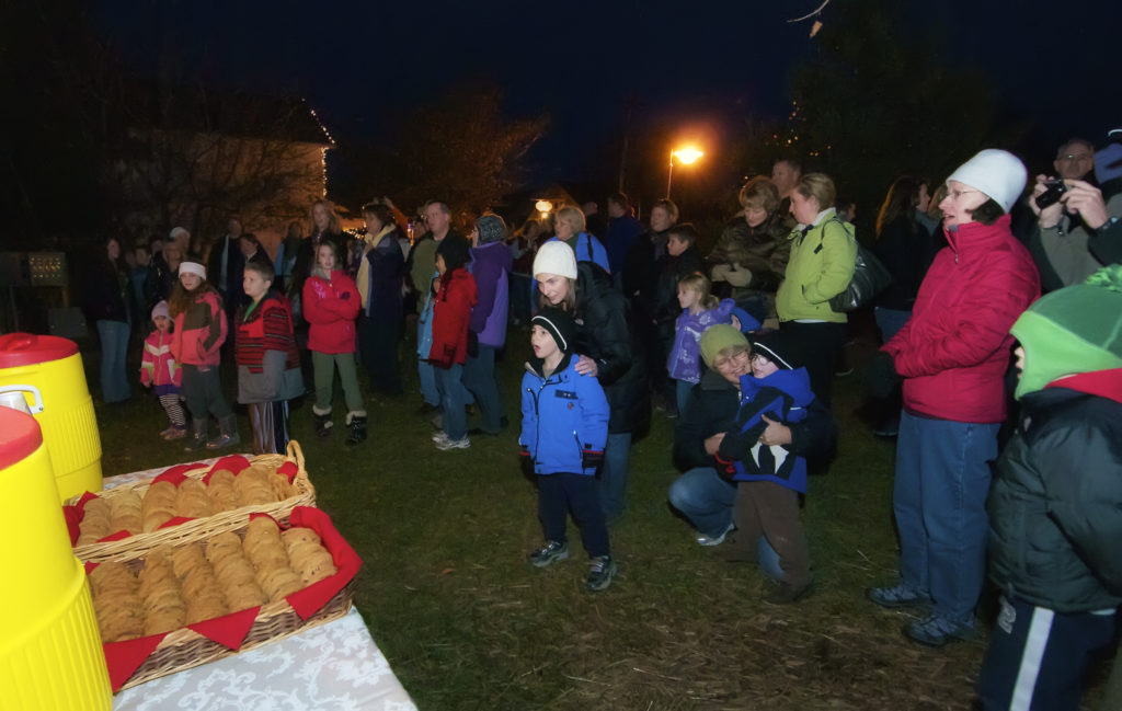 People gather for hot chocolate and cookies at the Egg Harbor tree lighting ceremony in Egg Harbor. Photo by Len Villano.