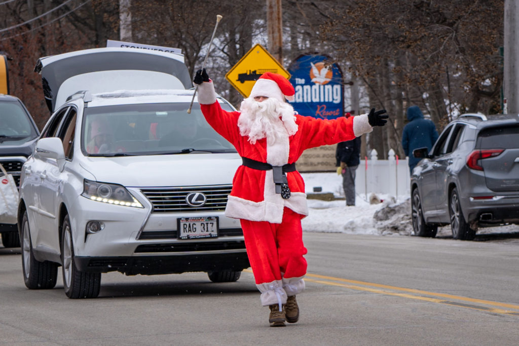 Christine Tierney donned her Santa suit and twirled her way down the street as the leader of the Egg Harbor New Year’s Day parade for the 41st year. Photo by Rachel Lukas.